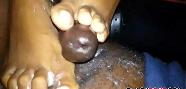  Ebony GF gives footjob